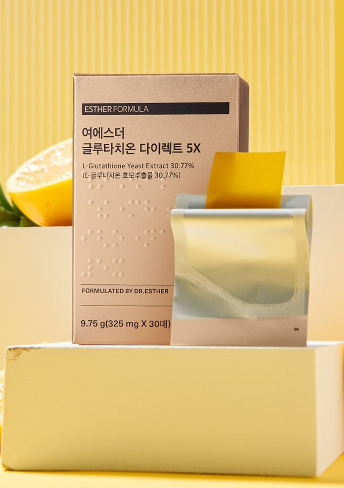 Lyuh Esther Glutathione Direct 5X skincare product shown with its box and a clear jar containing a yellow gel, set on a white pedestal against a bright yellow background with text reading 'Glutathione 5X For Balanced Wellness'.